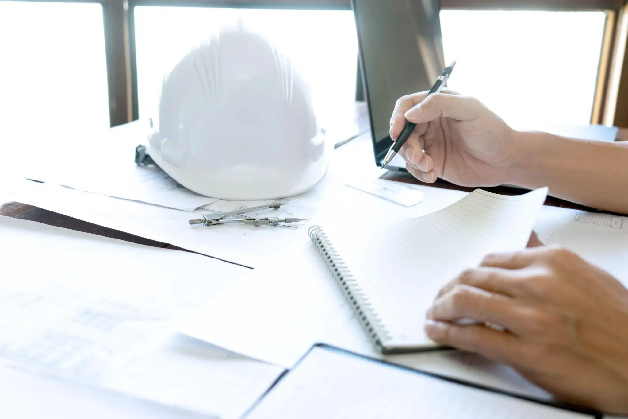 Contractor reviewing application documents and construction plans during the California contractor licensing process.