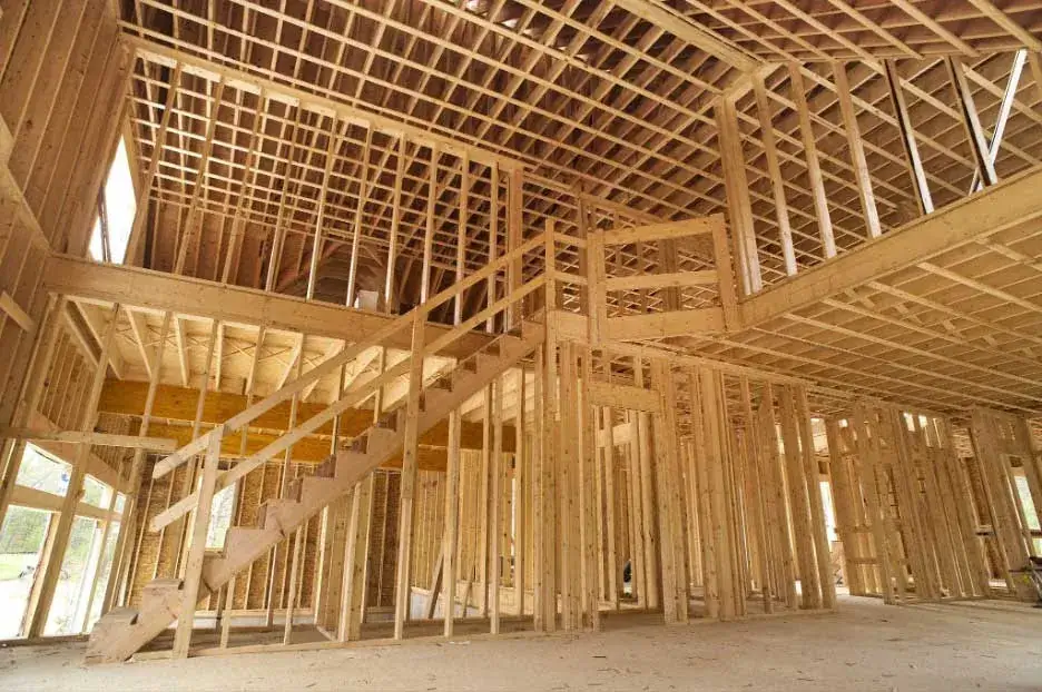 Interior framing of new house under construction.