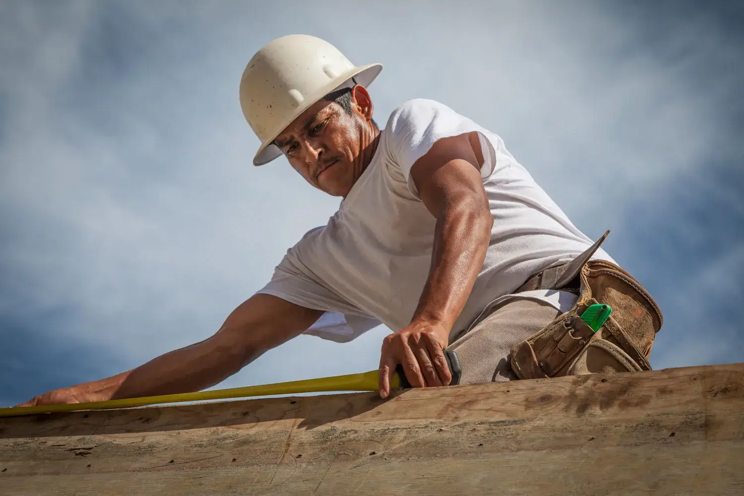 spanish contractor working on roofing construction